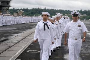 Sailors man the rails aboard the aircraft carrier USS Nimitz at Naval Base Kitsap-Bremerton on June 1. The Nimitz is preparing to get underway to Naval Air Station North Island, where they will join other Navy squadrons on a regularly scheduled six-month deployment. Photo: U.S. Navy photo - Mass Communications Specialist Seaman Ian Kinkead
