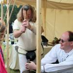 Two SCA members demonstrate how to make coins at the Kitsap Medieval Faire June 3.                                Michelle Beahm / Kitsap News Group