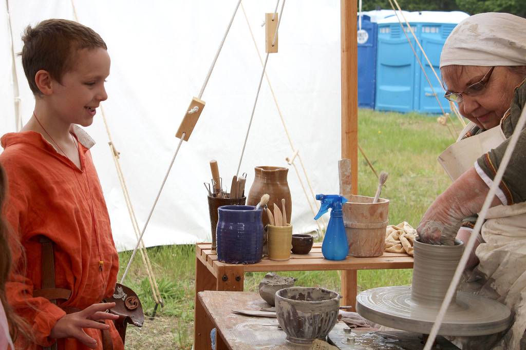 An SCA member demonstrates pottery making using period-appropriate techniques.                                Michelle Beahm / Kitsap News Group