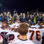 Dozens of Centralia High School football players surround Joe Kennedy, then-assistant football coach, for a prayer on the 50-yard line Oct. 16, 2015. Judge M. Smith, 9th Circuit Court of Appeals, brought up this photo when Kennedy&rsquo;s lawyer Rebekah Ricketts said they were fighting for Kennedy&rsquo;s right to &ldquo;pray quietly and alone.&rdquo;                                Kitsap News Group file photo