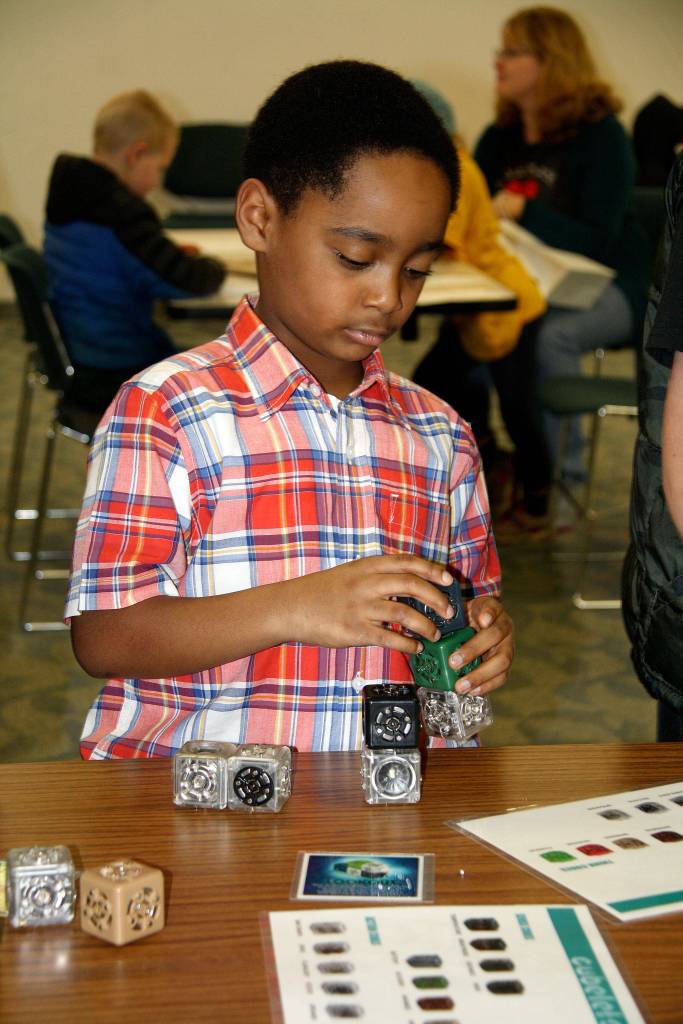 A child builds a robot at the 2016 Summer STEAM 
program at the U.S, Naval Undersea Museum in Keyport.                                U.S. Naval Undersea Museum/Courtesy