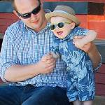 Kellyn King, 1, has a rousing good time with his uncle Brandon King while standing on the gazebo grandstands in Waterfront Park. Dad Dakota King looks on.                                Bob Smith | Independent