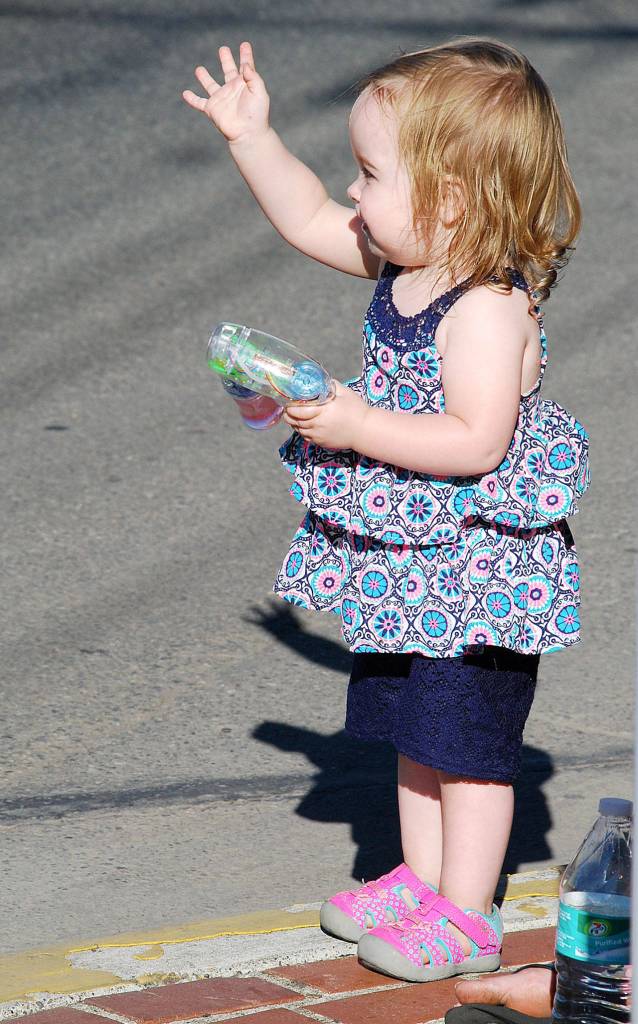 A future princess waves to the Fathoms O&rsquo; Fun&rsquo;s royal court aboard their float. Photo credit: Bob Smith | Kitsap Daily News