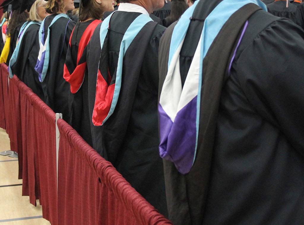The colorful hoods worn by the faculty denote the college or university from which they graduated.                                Terryl Asla| Kitsap News Group