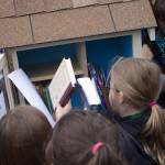 Fifth-graders at Vinland Elementary fill their Little Free Library with donations of their favorite books. Terryl Asla/Kitsap News Group
