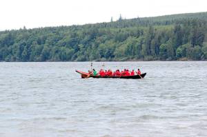 The Port Gamble S&rsquo;Klallam canoe family travels from Point Julia to the former site of the Port Gamble mill, June 8. (Sophie Bonomi/Kitsap News Group)