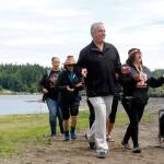 Olympic Property Group president Jon Rose joins Port Gamble S&rsquo;Klallam Tribe members in a dance on June 8 at the celebration of the cleanup of the former mill site and nearshore, at Port Gamble. (Sophie Bonomi/Kitsap News Group)