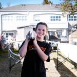 Womens 1x - Brooke Organ carries boat down before practice. Contributed