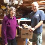 Alix Kosin and Howie O&rsquo;Brien sort more than 5,000 books in preparation for the big Greater Hansville Community Center book sale June 9-11. (Annette Wright / Contributed)