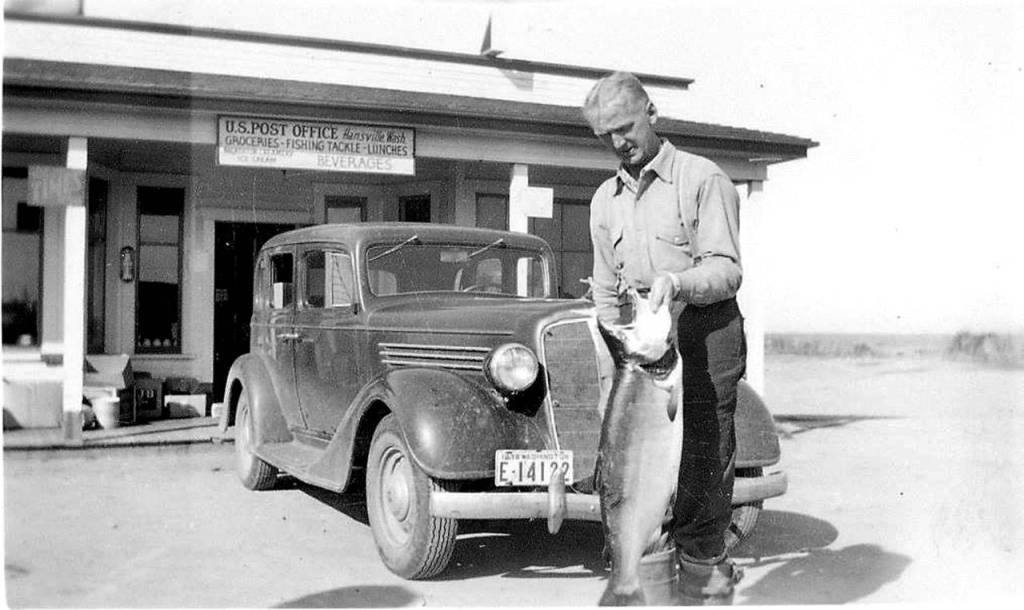 Happy customer in front of Erickson&rsquo;s Store and the Post Office, (now the Hansgrill) in the 1930s.