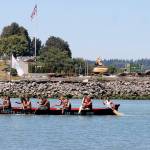 A canoe from Queets, on the Pacific Coast, arrives at Point Julia during the 2016 Canoe Journey. (Richard Walker)