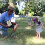Bob Gemmell and his grand-daughter Penelope at the Suquamish Tribal Cemetary July 8. (Courtesy Gemmell family)