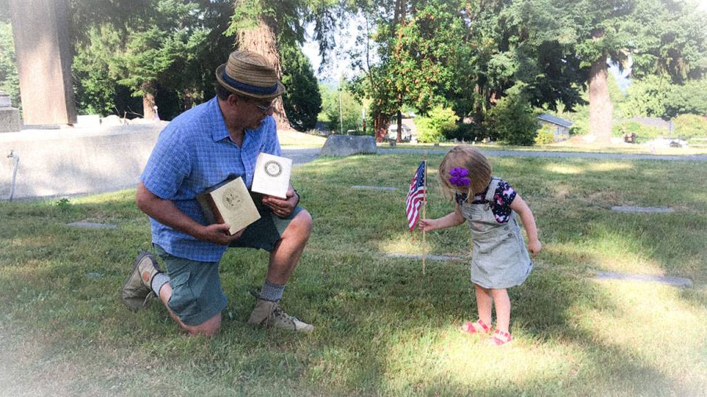 Bob Gemmell and his grand-daughter Penelope at the Suquamish Tribal Cemetary July 8. (Courtesy Gemmell family)