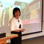 Dr. Kay Ash, vice president for Administrative Services at Olympic College, explains the partnership between the school and Western Washington University for a group of Seattle-area officials and business leaders. (Mark Krulish/Kitsap News Group)