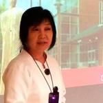 Dr. Kay Ash, vice president for Administrative Services at Olympic College, explains the partnership between the school and Western Washington University for a group of Seattle-area officials and business leaders. (Mark Krulish/Kitsap News Group)