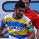 Kitsap SC midfielder Jesus Sanchez attempts to dribble past Portland midfielder Ryan Callahan during the July 15 first round playoff match. (Mark Krulish/Kitsap News Group)