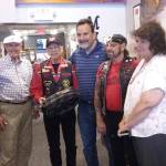 The Suquamish Tribe presents a model of a Coast Salish canoe to the Poulsbo Maritime Museum, July 14.From left, museum board president Tom Henderson, Rich Demain, Suquamish Tribe Chairman Leonard Forsman, Ray Holdroc of the Suquamish Warriors veterans group, and Poulsbo Mayor Becky Erickson.  Ian A. Snively / Kitsap News Group