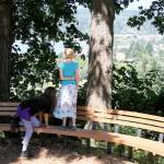 Abi Ferguson, age 11, climbs up onto the bench to be with Jacqui Conger, age 8, as they admire the panoramic view of Liberty Bay from the overlook at Raab Park.                                Terryl Asla/Kitsap News Group