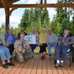 Cruz Strom and residents at the Madrona House on Bainbridge Island enjoy the new gazebo built by Strom and his volunteers. (Mark Krulish/Kitsap News Group)