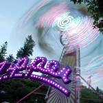 The Fathoms O&rsquo; Fun Carnival&rsquo;s Zipper ride was awash in color as dusk fell on the Port Orchard waterfront. Photo: Bob Smith | Kitsap Daily News