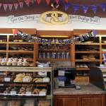 The golden pretzel on the wall behind the counter in Sluys&rsquo; Bakery. The motto below it says &ldquo;Give us this day our daily bread&rdquo; in Norwegian.                                Terryl Asla/Kitsap News Group