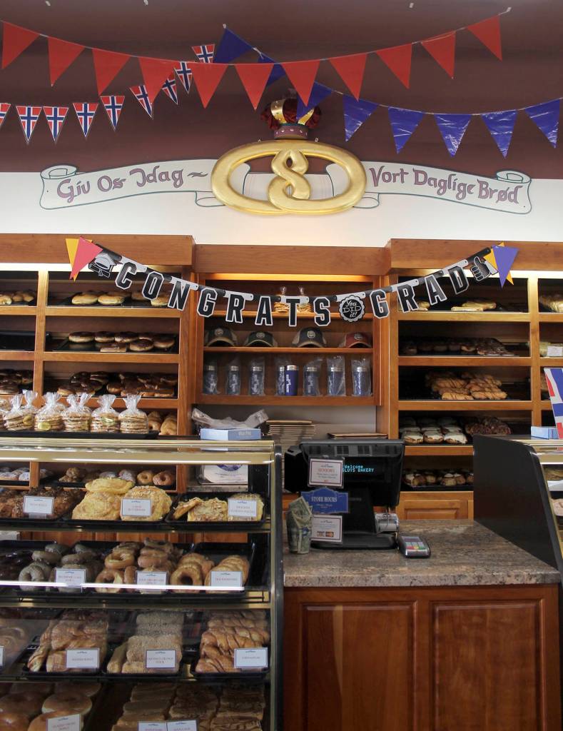 The golden pretzel on the wall behind the counter in Sluys&rsquo; Bakery. The motto below it says &ldquo;Give us this day our daily bread&rdquo; in Norwegian.                                Terryl Asla/Kitsap News Group