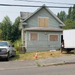 The house at 19159 8th Ave. NE. is going to be coming down &mdash; finally. OnAug. 7, workers from KCB Environmental were hard at work removing asbestos and anyother hazardous materials. Once they&rsquo;re done, the house is slated to come down &ldquo;in thenext month or so,&rdquo; said Poulsbo Public Works Director Mike Lund.                                Terryl Asla/Kitsap News Group