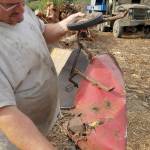 Scrap materials, such as concrete chunks, bricks and even this mangled metal toy wheelbarrow, are separated from the wood before it is ground.                                Terryl Asla/Kitsap News Group