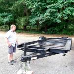 Bob Bretey describes the dimensions of the RV trailer frame his model sits on. Photo: Bob Smith | Kitsap Daily News