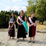 Young women await the arrival of a canoe, from left, 2017-18 Miss Chief Seattle Days Katelynn Pratt, 2016-17 Miss Chief Seattle Days Hailey Crow, 2016-17 Jr. Miss Chief Seattle Days Mackenzie Crow. (Antonia Stoyanovich photo)
