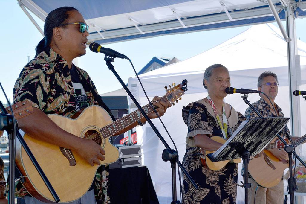 Members of Halau Hula O&rsquo; Healani Mai Ka &rsquo; Aina &lsquo;Ona Kumula&rsquo;au Ki &lsquo;Eki &lsquo;E entertained the crowd. (Mark Krulish/Kitsap News Group)