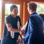 From right, U.S. Rep. Derek Kilmer, D-Gig Harbor, meets a Millennial constituent Aug. 29 at Kiana Lodge. (Sophie Bonomi/Kitsap News Group)