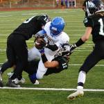 Senior running back SemaJ Cook breaks through the defense to give Bremerton a 13-0 lead in the first quarter. (Mark Krulish/Kitsap News Group)