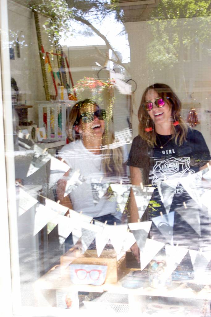 Sisters Kelsey Hanson and Emily Young laugh as they prepare for a new business venture &mdash; similar to their grandmothers business ventures decades ago &mdash; Aug. 25. (Sophie Bonomi/Kitsap News Group)