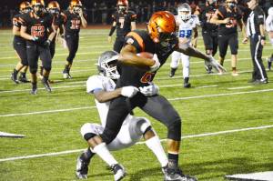 Sophomore receiver Ja&rsquo;Quirious Conley is tackled by the defense after a 13-yard reception. (Mark Krulish/Kitsap News Group)