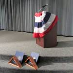 The empty podium and cased flags commemorate the passing of a generation and almost a quarter-century of honoring one of the darkest &mdash; and ultimately greatest &mdash; days of infamy in U.S. history.                                Terryl Asla/Kitsap News Group
