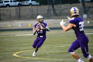North Kitsap quarterback Andrew Blackmore (15) looks for an open receiver downfield in his team&rsquo;s 25-14 win over Central Kitsap. (Mark Krulish/Kitsap News Group)