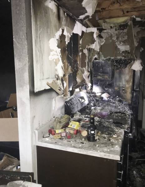 The fire was contained to the kitchen. The county fire marshal determined that the blaze began at the stove; one of the residents said he had been cooking with grease. (Ileana LiMarzi/Central Kitsap Fire & Rescue)