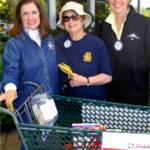 From left, Poulsbo Lion Denise Zaske and Poulsbo Rotarians Anita Blau and Cindy Garfein collect food and donations at the 2016 Lions/Rotary Food Drive for Fishline. Look for them again this weekend at Central Market, Red Apple and Walmart in Poulsbo.                                Contributed photo