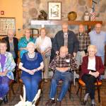Members of the North Kitsap High School Class of 1947. Back row: Vernon Martinson, Pat Strand, Neva Rice, Louise Love, Ray Drummond, Bud Pierce, Jim Pickrell and Ted George. Bottom row: Carolynn Swearingen, Lila Brazeau, Kaare Jacobsen and Arlene Updyke.  Mark Krulish/Kitsap News Group