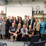 The Washington Business Alliance, administrators from the Central Kitsap School District, Sen. Christine Rolfes, D-23rd District, and Rolfes&rsquo; team gather in the Ridgetop Middle School Library, where Rolfes accepted an award from the WBA after they group toured the school&rsquo;s aviation classroom.                                Michelle Beahm / Kitsap News Group