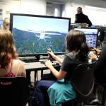 Ridgetop Middle School students learn about aviation from first-class technology that includes flight simulation programs.                                Michelle Beahm / Kitsap News Group