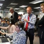 Sen. Christine Rolfes, D-23rd District, and Ridgetop Middle School Principal Rusty Willson talk to students in the aviation class.                                Michelle Beahm / Kitsap News Group