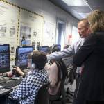 Sen. Christine Rolfes, D-23rd District, and Ridgetop Middle School Principal Rusty Willson talk to students in the aviation class.                                Michelle Beahm / Kitsap News Group
