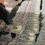 In a car in the Poulsbo Safeway parking garage early Sept. 24, officers found two stolen handguns, two stolen fire service portable radios, stolen fire department equipment, body armor, ammunition, two fake badges, more than 30 grams of heroin and methamphetamine, and more than $9,500 in cash. (Kitsap County Sheriff&rsquo;s Office)