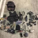 In a car in the Poulsbo Safeway parking garage early Sept. 24, officers found two stolen handguns, two stolen fire service portable radios, stolen fire department equipment, body armor, ammunition, two fake badges, more than 30 grams of heroin and methamphetamine, and more than $9,500 in cash. (Kitsap County Sheriff&rsquo;s Office)