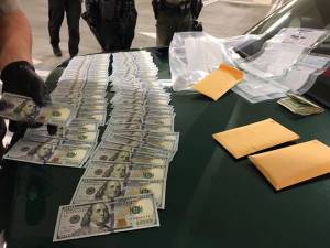 In a car in the Poulsbo Safeway parking garage early Sept. 24, officers found two stolen handguns, two stolen fire service portable radios, stolen fire department equipment, body armor, ammunition, two fake badges, more than 30 grams of heroin and methamphetamine, and more than $9,500 in cash. Kitsap County Sheriff&rsquo;s Office