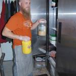 Bob Smith | Independent                                Co-owner Paul Robinson, who also is the restaurant&rsquo;s chef, pulls recipe items from the tiny kitchen&rsquo;s refrigerator.