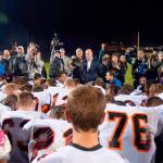 Centralia High School football players surround Joe Kennedy, then-assistant football coach for Bremerton High School, for a prayer on the 50-yard line Oct. 16, 2015. A 9th Circuit Court of Appeals judge brought up this photo when Kennedy&rsquo;s lawyer, Rebekah Ricketts, said they were fighting for Kennedy&rsquo;s right to &ldquo;pray quietly and alone.&rdquo;                                (Chris Tucker / Kitsap News Group 2015)