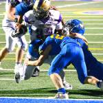 North Kitsap running back Dax Solis bulls his way through a group of defenders on his way to a touchdown. (Mark Krulish/Kitsap News Group)